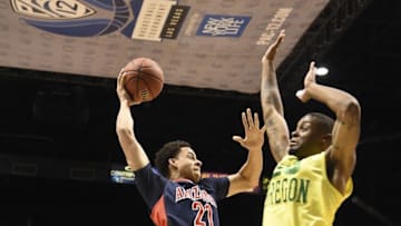 March 11, 2016; Las Vegas, NV, USA; Arizona Wildcats center Chance Comanche (21) shoots the basketball against Oregon Ducks forward Elgin Cook (23) during the first half in the semifinals of the Pac-12 Conference tournament at MGM Grand Garden Arena. Mandatory Credit: Kyle Terada-USA TODAY Sports