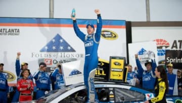 Mar 1, 2015; Hampton, GA, USA; NASCAR Sprint Cup Series driver Jimmie Johnson (48) celebrates winning the Folds of Honor QuikTrip 500 at Atlanta Motor Speedway. Mandatory Credit: Kevin Liles-USA TODAY Sports