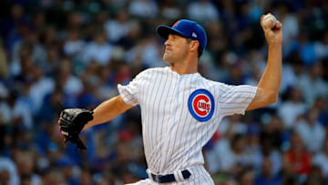 CHICAGO, IL - AUGUST 12: Cole Hamels #35 of the Chicago Cubs pitches against the Washington Nationals during the first inning at Wrigley Field on August 12, 2018 in Chicago, Illinois. (Photo by Jon Durr/Getty Images)