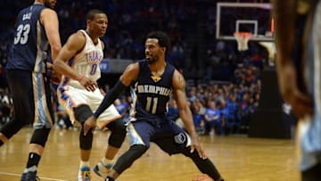 Oct 13, 2016; Tulsa, OK, USA; Memphis Grizzlies guard Mike Conley (11) drives to the basket in front of Oklahoma City Thunder guard Russell Westbrook (0) during the second quarter at BOK Center. Mandatory Credit: Mark D. Smith-USA TODAY Sports