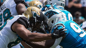 Sep 13, 2015; Jacksonville, FL, USA; Jacksonville Jaguars tight end Clay Harbor (86) blocks Carolina Panthers defensive end Charles Johnson (95) during the first quarter at EverBank Field. Mandatory Credit: Jerome Miron-USA TODAY Sports