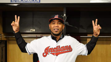 Jan 5, 2017; Cleveland, OH, USA; Cleveland Indians newly acquired player Edwin Encarnacion puts on his new jersey during a press conference at Progressive Field. Mandatory Credit: Ken Blaze-USA TODAY Sports