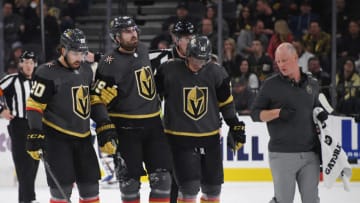 LAS VEGAS, NEVADA - FEBRUARY 13: Alex Tuch #89 of the Vegas Golden Knights is helped off the ice by teammates Chandler Stephenson #20 and Cody Eakin #21 after Tuch appeared to hurt his left knee in the third period of a game against the St. Louis Blues at T-Mobile Arena on February 13, 2020 in Las Vegas, Nevada. The Golden Knights defeated the Blues 6-5 in overtime. (Photo by Ethan Miller/Getty Images)