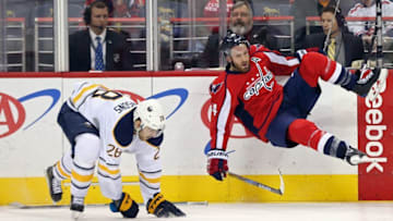 Dec 5, 2016; Washington, DC, USA; Buffalo Sabres center Zemgus Girgensons (28) checks Washington Capitals defenseman Brooks Orpik (44) in the third period at Verizon Center. The Capitals won 3-2 in overtime. Mandatory Credit: Geoff Burke-USA TODAY Sports