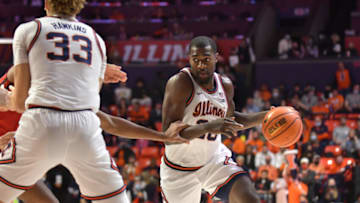 Dec 3, 2021; Champaign, Illinois, USA; Illinois Fighting Illini guard Da'Monte Williams (20) drives the ball during the first half against the Rutgers Scarlet Knights at State Farm Center. Mandatory Credit: Ron Johnson-USA TODAY Sports