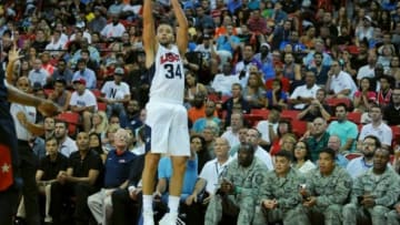 Aug 1, 2014; Las Vegas, NV, USA; Fans watch as USA Team White forward Chandler Parsons (34) attempts a three-point shot during the USA Basketball Showcase at Thomas & Mack Center. Mandatory Credit: Stephen R. Sylvanie-USA TODAY Sports