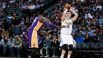 Mar 2, 2016; Denver, CO, USA; Denver Nuggets center Nikola Jokic (15) takes a shot against Los Angeles Lakers center Roy Hibbert (17) in the first quarter at the Pepsi Center. Mandatory Credit: Isaiah J. Downing-USA TODAY Sports