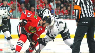 May 21, 2014; Chicago, IL, USA; Chicago Blackhawks center Jonathan Toews (19) and Los Angeles Kings center Anze Kopitar (11) face off during the first period of game two of the Western Conference Final of the 2014 Stanley Cup Playoffs at the United Center. Mandatory Credit: Dennis Wierzbicki-USA TODAY Sports