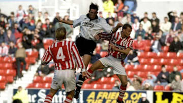 12 Oct 1997: Lee Mills of Stoke City outjumps the Port Vale defence during a Nationwide League Division One match at the Victoria Ground in Stoke-on-Trent, England. Stoke City won the match 2-1. Mandatory Credit: Julian Herbert/Allsport