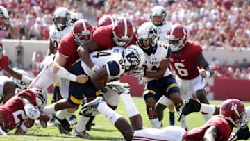 Sep 24, 2016; Tuscaloosa, AL, USA; Alabama Crimson Tide running back B.J. Emmons (21) wraps up Kent State Golden Flashes wide receiver Kavious Price (84) on a kickoff return at Bryant-Denny Stadium. Mandatory Credit: Marvin Gentry-USA TODAY Sports