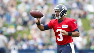 Jul 30, 2016; Renton, WA, USA; Seattle Seahawks quarterback Russell Wilson (3) tosses the ball to a teammate during training camp at the Virginia Mason Athletic Center. Mandatory Credit: Joe Nicholson-USA TODAY Sports
