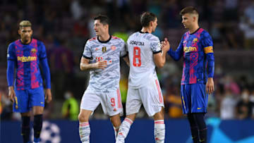 Leon Goretzka of Bayern Munich and Gerard Pique of Barcelona. (Photo by David Ramos/Getty Images)