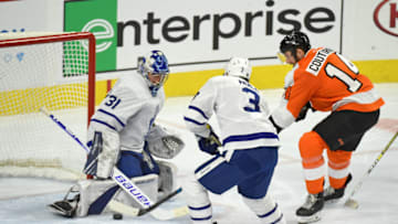 Dec 3, 2019; Philadelphia, PA, USA; Toronto Maple Leafs goaltender Frederik Andersen (31) makes a save against Philadelphia Flyers center Sean Couturier (14) during the third period at Wells Fargo Center. Mandatory Credit: Eric Hartline-USA TODAY Sports