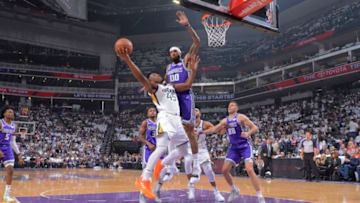 SACRAMENTO, CA - OCTOBER 17: Donovan Mitchell #45 fo the Utah Jazz goes up for the shot against Willie Cauley-Stein #00 of the Sacramento Kings on October 17, 2018 at Golden 1 Center in Sacramento, California. NOTE TO USER: User expressly acknowledges and agrees that, by downloading and or using this photograph, User is consenting to the terms and conditions of the Getty Images Agreement. Mandatory Copyright Notice: Copyright 2018 NBAE (Photo by Rocky Widner/NBAE via Getty Images)