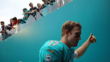 Jan 3, 2016; Miami Gardens, FL, USA; Miami Dolphins quarterback Ryan Tannehill (17) walks off the field against the New England Patriots at Sun Life Stadium. The Dolphins won 20-10. Mandatory Credit: Steve Mitchell-USA TODAY Sports