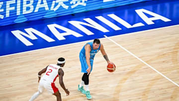 Slovenia's Luka Doncic (R) and Canada's Shai Gilgeous-Alexander vie for the ball (Photo by SHERWIN VARDELEON/AFP via Getty Images)
