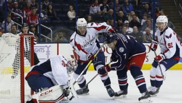 Nov 15, 2016; Columbus, OH, USA; Washington Capitals goalie Philipp Grubauer (31) makes a save against Columbus Blue Jackets defenseman Jack Johnson (7) during overtime at Nationwide Arena. Columbus beat Washington in overtime 3-2. Mandatory Credit: Russell LaBounty-USA TODAY Sports