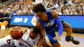 Auburn Tigers wing Isaac Okoro (#23) comes up with a loose ball. (Photo by Todd Kirkland/Getty Images)