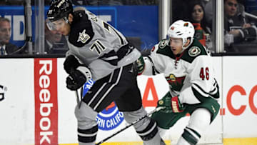 Jan 7, 2017; Los Angeles, CA, USA; Los Angeles Kings center Jordan Nolan (71) and Minnesota Wild defenseman Jared Spurgeon (46) chase down the puck in the third period of the game at Staples Center. Kings won 4-3 in overtime. Mandatory Credit: Jayne Kamin-Oncea-USA TODAY Sports