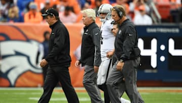 DENVER, CO - OCTOBER 1: Derek Carr (4) of the Oakland Raiders walks off the field after being injured in the third quarter of the game against the Denver Broncos. Carr was hurt on the play and left the game. The Denver Broncos hosted the Oakland Raiders at Sports Authority Field at Mile High in Denver, Colorado on Sunday, October 1, 2017. (Photo by John Leyba/The Denver Post via Getty Images)