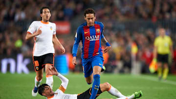 BARCELONA, SPAIN - MARCH 19: Neymar Jr of Barcelona is tackled by Enzo Perez of Valencia during the La Liga match between FC Barcelona and Valencia CF at Camp Nou Stadium on March 19, 2017 in Barcelona, Spain. (Photo by fotopress/Getty Images)