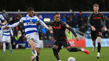 LONDON, ENGLAND - FEBRUARY 15: Tom Ince of Stoke City is challenged by Dominic Ball of Queens Park Rangers during the Sky Bet Championship match between Queens Park Rangers and Stoke City at The Kiyan Prince Foundation Stadium on February 15, 2020 in London, England. (Photo by Andrew Redington/Getty Images)
