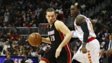 Feb 19, 2016; Atlanta, GA, USA; Miami Heat guard Beno Udrih (19) drives past Atlanta Hawks guard Dennis Schroder (17) in the fourth quarter at Philips Arena. The Heat defeated the Hawks 115-111. Mandatory Credit: Brett Davis-USA TODAY Sports