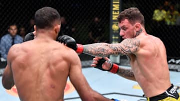 LAS VEGAS, NEVADA - JUNE 26: (R-L) Renato Moicano of Brazil punches Jai Herbert of England in a lightweight fight during the UFC Fight Night event at UFC APEX on June 26, 2021 in Las Vegas, Nevada. (Photo by Chris Unger/Zuffa LLC)