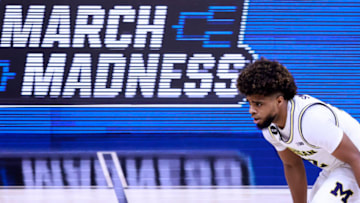 INDIANAPOLIS, INDIANA - MARCH 13: Mike Smith #12 of the Michigan Wolverines brings the ball up the court in the game against the Ohio State Buckeyes during the second half of the Big Ten men's basketball tournament semifinals at Lucas Oil Stadium on March 13, 2021 in Indianapolis, Indiana. (Photo by Justin Casterline/Getty Images)