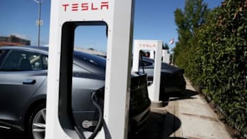 FREMONT, CA - AUGUST 16: A Tesla Model S sedan is seen plugged into a new Tesla Supercharger outside of the Tesla Factory on August 16, 2013 in Fremont, California. Tesla Motors opened a new Supercharger station with four stalls for public use at their factory in Fremont, California. The Superchargers allow owners of the Tesla Model S to charge their vehicles in 20 to 30 minutes for free. There are now 18 charging stations in the U.S. with plans to open more in the near future. (Photo by Justin Sullivan/Getty Images)