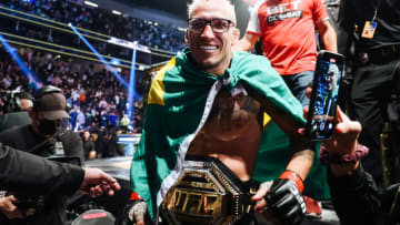 LAS VEGAS, NEVADA - DECEMBER 11: Charles Oliveira of Brazil celebrates after defeating Dustin Poirier to defend his lightweight title during the UFC 269 event at T-Mobile Arena on December 11, 2021 in Las Vegas, Nevada. (Photo by Carmen Mandato/Getty Images)
