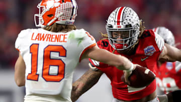 GLENDALE, ARIZONA - DECEMBER 28: Chase Young #2 of the Ohio State Buckeyes pursues Trevor Lawrence #16 of the Clemson Tigers in the first half during the College Football Playoff Semifinal at the PlayStation Fiesta Bowl at State Farm Stadium on December 28, 2019 in Glendale, Arizona. (Photo by Matthew Stockman/Getty Images)