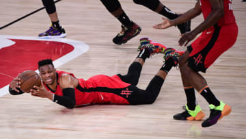 LAKE BUENA VISTA, FLORIDA - SEPTEMBER 06: Russell Westbrook #0 of the Houston Rockets is fouled during the fourth quarter against the Los Angeles Lakers in Game Two of the Western Conference Second Round during the 2020 NBA Playoffs at AdventHealth Arena at the ESPN Wide World Of Sports Complex on September 06, 2020 in Lake Buena Vista, Florida. NOTE TO USER: User expressly acknowledges and agrees that, by downloading and or using this photograph, User is consenting to the terms and conditions of the Getty Images License Agreement. (Photo by Douglas P. DeFelice/Getty Images)