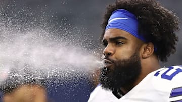 ARLINGTON, TX - SEPTEMBER 30: Ezekiel Elliott #21 of the Dallas Cowboys spits water before a game against the Detroit Lions at AT&T Stadium on September 30, 2018 in Arlington, Texas. (Photo by Ronald Martinez/Getty Images)