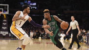 Apr 3, 2016; Los Angeles, CA, USA; Boston Celtics guard Marcus Smart (36) drives past Los Angeles Lakers guard D'Angelo Russell (1) during the second half at Staples Center. Mandatory Credit: Richard Mackson-USA TODAY Sports