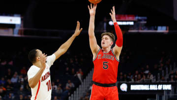 Dec 21, 2019; San Francisco, California, USA; St. John's Red Storm guard David Caraher (5) shoots over Arizona Wildcats guard Jemarl Baker Jr. (10) during the second half at Chase Center. Mandatory Credit: Darren Yamashita-USA TODAY Sports