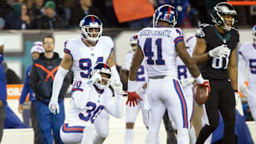 Dec 22, 2016; Philadelphia, PA, USA; New York Giants cornerback Dominique Rodgers-Cromartie (41) reacts with cornerback Eli Apple (24) after his interception during the first half against the Philadelphia Eagles at Lincoln Financial Field. Mandatory Credit: Bill Streicher-USA TODAY Sports