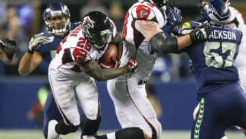 SEATTLE, WA - NOVEMBER 20: Running back Tevin Coleman #26 of the Atlanta Falcons rushes against the Seattle Seahawks in the fourth quarter at CenturyLink Field on November 20, 2017 in Seattle, Washington. (Photo by Otto Greule Jr /Getty Images)