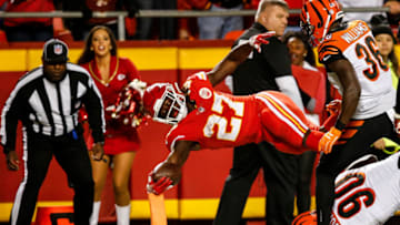 KANSAS CITY, MO - OCTOBER 21: Kareem Hunt #27 of the Kansas City Chiefs dives across the goal line for the second touchdown of the game during the second quarter of the game against the Cincinnati Bengals at Arrowhead Stadium on October 21, 2018 in Kansas City, Kansas. (Photo by David Eulitt/Getty Images)