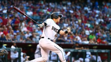 Jun 14, 2016; Phoenix, AZ, USA; Arizona Diamondbacks batter Jake Lamb hits an RBI out in the first inning against the Los Angeles Dodgers at Chase Field. Mandatory Credit: Mark J. Rebilas-USA TODAY Sports