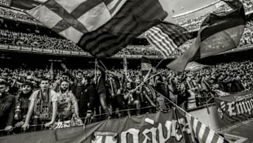 BARCELONA, SPAIN - DECEMBER 03: (EDITORS NOTE: This images has been converted to black and white) FC Barcelona fans cheers on their team prior to the La Liga match between FC Barcelona and Real Madrid CF at Camp Nou stadium on December 3, 2016 in Barcelona, Spain. (Photo by David Ramos/Getty Images)