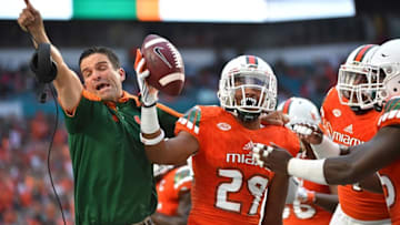 Sep 3, 2016; Miami Gardens, FL, USA; Miami Hurricanes defensive back Corn Elder (29) celebrates with teammates after intercepting a pass against the Florida A&M Rattlers during the first half at Hard Rock Stadium. Mandatory Credit: Jasen Vinlove-USA TODAY Sports