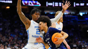 Mar 27, 2022; Philadelphia, PA, USA; North Carolina Tar Heels guard Caleb Love (2) defends against St. Peters Peacocks guard Daryl Banks III (5) during the first half in the finals of the East regional of the men's college basketball NCAA Tournament at Wells Fargo Center. Mandatory Credit: Mitchell Leff-USA TODAY Sports