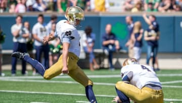 Apr 16, 2016; South Bend, IN, USA; Notre Dame Fighting Irish kicker Justin Yoon (19) attempts an extra point as Montgomery VanGorder (4) holds in the second quarter of the Blue-Gold Game at Notre Dame Stadium. The Blue team defeated the Gold team 17-7. Mandatory Credit: Matt Cashore-USA TODAY Sports