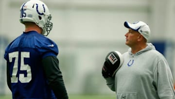 INDIANAPOLIS, IN - MAY 16: Offensive line coach Joe Gilbert of the Indianapolis Colts gives instruction to second round draft pick Jack Mewhort #75 during a rookie minicamp at the team complex on May 16, 2014 in Indianapolis, Indiana. (Photo by Joe Robbins/Getty Images)