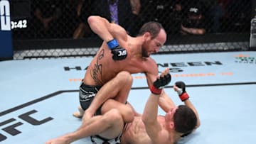 LAS VEGAS, NEVADA - OCTOBER 09: (L-R) Damon Jackson punches Charles Rosa in their featherweight bout during the UFC Fight Night event at UFC APEX on October 09, 2021 in Las Vegas, Nevada. (Photo by Josh Hedges/Zuffa LLC)