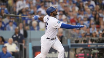 Oct 28, 2018; Los Angeles, CA, USA; Los Angeles Dodgers outfielder Yasiel Puig (66) hits a single in the second inning against the Boston Red Sox in game five of the 2018 World Series at Dodger Stadium. Mandatory Credit: Gary A. Vasquez-USA TODAY Sports