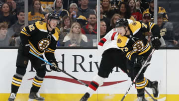 BOSTON, MA - SEPTEMBER 25: Boston Bruins right defenseman Charlie McAvoy (73) looks to clear the puck during a preseason game between the Boston Bruins and the New Jersey Devils on September 25, 2019, at TD Garden in Boston, Massachusetts. (Photo by Fred Kfoury III/Icon Sportswire via Getty Images)