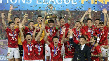 GUANGZHOU, CHINA - NOVEMBER 21: Players of Guangzhou Evergrande celebrate with trophy after winning the Asian Champions League Final 2nd leg Match between Guangzhou Evergrande and Al Ahli at Tianhe Sports Center on November 21, 2015 in Guangzhou, China. (Photo by Zhong Zhi/Getty Images)