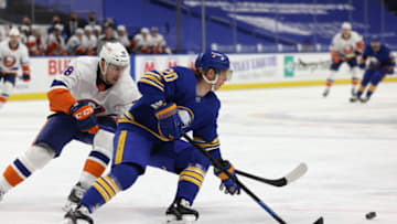 Feb 15, 2021; Buffalo, New York, USA; Buffalo Sabres center Cody Eakin (20) goes after the puck as New York Islanders left wing Michael Dal Colle (28) defends during the third period at KeyBank Center. Mandatory Credit: Timothy T. Ludwig-USA TODAY Sports